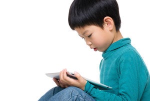 kid reading ipad